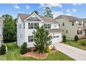 Beautiful home with well-manicured lawn and landscaping, complemented by a two-car garage and inviting driveway at 2912 Historic Cir, Morrisville, NC 27560