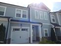 Well-maintained two-story townhome with attached one car garage, appealing curb appeal at 3005 Dunnock Dr, Durham, NC 27713