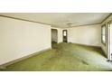 Spacious living room featuring lots of natural light and carpeted flooring at 315 Clark St, Durham, NC 27701