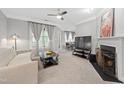 Relaxing living room with plush carpet, neutral colors, and plenty of natural light at 324 Providence Glen Dr, Chapel Hill, NC 27514