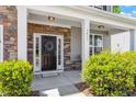 Inviting front entry features stone accents and a decorative wreath at 3411 Massey Pond Trl, Raleigh, NC 27616