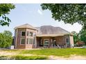Expansive backyard patio with outdoor seating, perfect for entertaining at 3704 Hesters Store Rd, Hurdle Mills, NC 27541