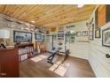Versatile space featuring wood paneled walls, perfect for a home gym or office with tons of natural light at 417 S Fourth St, Mebane, NC 27302