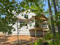 Framing for new home showing rear view with framed deck and multiple windows at 485 Chapel Ridge Dr, Pittsboro, NC 27312