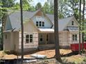 New construction home featuring a charming craftsman style and inviting covered entry at 485 Chapel Ridge Dr, Pittsboro, NC 27312