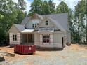 View of exterior with new construction details, including covered entry and building materials at 485 Chapel Ridge Dr, Pittsboro, NC 27312