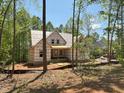 Exterior view of new home construction with covered entryway and building framework at 485 Chapel Ridge Dr, Pittsboro, NC 27312