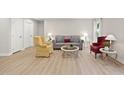 Cozy living room showcasing stylish furniture, neutral walls, and hardwood flooring at 55 Boots Ridge Way, Franklinton, NC 27525