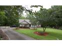 A well-maintained front yard complements the brick and siding exterior of this inviting home at 5600 Treestand Ct, Garner, NC 27529