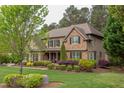 A stunning stone and shingle home with lush landscaping, perfect for curb appeal at 7633 Summer Pines Way, Wake Forest, NC 27587