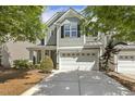 Inviting home with a spacious two-car garage and a well-maintained front yard at 7728 Cape Charles Dr, Raleigh, NC 27617