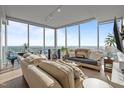 Inviting living room with floor-to-ceiling windows offering panoramic views at 110 N Corcoran St # 2101, Durham, NC 27701