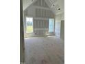 Large bedroom with vaulted ceilings and natural light streaming through the windows at 11226 Old Beulah Rd, Kenly, NC 27542
