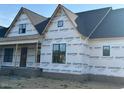 View of the new home's front exterior, showcasing large windows at 11226 Old Beulah Rd, Kenly, NC 27542