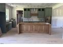 Spacious kitchen featuring custom cabinets and a large center island, ready for personalization at 11226 Old Beulah Rd, Kenly, NC 27542