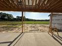 View of the exterior yard from the covered porch of the new home at 11226 Old Beulah Rd, Kenly, NC 27542