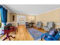 Spacious living room featuring hardwood floors, neutral paint, and an inviting seating area, creating a comfortable atmosphere at 1616 Beechwood Dr, Raleigh, NC 27609