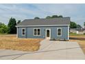 Charming single story home featuring a concrete driveway and minimalist landscaping at 19 Southern Village Dr, Roxboro, NC 27573