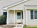 Inviting entryway with a covered porch and a decorative welcome mat at 203 Standish Dr, Chapel Hill, NC 27517