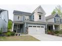 Charming two-story home with a two-car garage and stone accents at 2089 Florine Dr, Apex, NC 27502