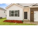 Inviting exterior featuring brick accents, gray shutters and fresh landscaping at 2736 Luxborough Ln, Mebane, NC 27302