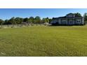 Large lawn, fenced horse property, and charming home with front porch at 2747 Beasley, Benson, NC 27504