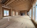 Spacious living room under construction, featuring large windows and an open floor plan at 516 Transylvania Ave, Raleigh, NC 27609