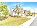 Charming two-story home with lush green lawn, and attached garage in quiet community at 5410 Jessip Street St, Morrisville, NC 27560