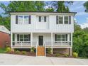 Charming two-story home with a covered porch, black shutters, and landscaped front yard at 621 Bon Air Ave, Durham, NC 27704