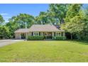 Charming single-story home with a well-manicured front yard and inviting entrance at 704 N Orange Ave, Dunn, NC 28334