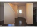 Bright foyer featuring hardwood floors and a view into the kitchen at 802 Brier Crossing Loop, Durham, NC 27703
