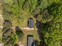 Aerial view of a house with a nice, wooded lot at 120 King Charles Rd, Hillsborough, NC 27278