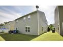 Spacious backyard features well-maintained grass and privacy; great for outdoor activities and relaxation at 123 Charndon Way, Fuquay Varina, NC 27526