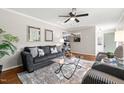 Comfortable living room with a plush sofa, stylish decor, and seamless flow to other rooms at 1701 Pinedale Dr, Raleigh, NC 27603