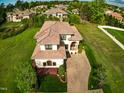 Beautiful tile roof on this stucco house surrounded by a lush green lawn and pond at 20 Al Aqua Dr, Durham, NC 27707