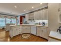 Bright kitchen featuring white cabinets, wood countertops, and hardwood floors at 208 E Harrington Ave, Broadway, NC 27505
