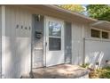 Close up of home's front door with peeling paint and chipping door frame at 2343 Derby Dr, Raleigh, NC 27610