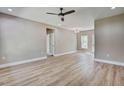 Spacious living room with hardwood floors, neutral walls, ceiling fan, and ample natural light at 2820 Tara Dr, Clayton, NC 27520