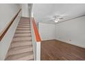 Bright entryway with new hardwood floors leading to staircase with wooden accents and lots of space at 300 Nc 54 # E3, Carrboro, NC 27510