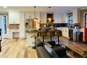 Modern eat-in kitchen with stainless appliances, island seating, hardwood floors and lots of natural light at 3018 Green Hill Dr, Chapel Hill, NC 27514