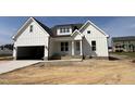 New white home with attached garage, covered entryway, and attractive curb appeal at 3820 Fairway View Dr # 16, Fuquay Varina, NC 27526