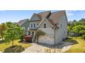 Attractive two-story home featuring a well-manicured lawn and an attached two-car garage at 3832 Crimson Clover Ave, Wake Forest, NC 27587