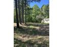 Exterior view of the home on a tree covered lot with a yard at 4501 Duraleigh Rd, Raleigh, NC 27612