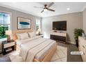 Bright bedroom with ceiling fan, modern decor, and plush rug, creating a relaxing space at 6245 Reagan Ln, Wake Forest, NC 27587