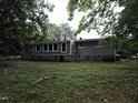 Rear view of the house, showing the back of the house with a large set of windows at 66 Toomer Loop Rd, Pittsboro, NC 27312