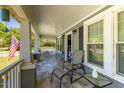 Close up of inviting front porch with comfortable seating and charming decor, offering a relaxing outdoor space at 7308 York, Mebane, NC 27302