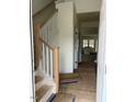 Bright foyer featuring hardwood floors, stairs with a wood handrail, and natural light at 1003 Shovelhead Dr # 2, Durham, NC 27703