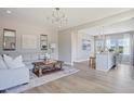 Comfortable living room with hardwood floors, neutral walls, modern decor and view into breakfast nook at 1003 Shovelhead Dr # 2, Durham, NC 27703