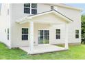 The home's backyard with a covered patio and sliding glass doors; great for outdoor entertaining and relaxation at 1044 Country Pasture Cv, Wendell, NC 27591