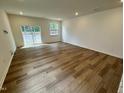 Bright living area with hardwood floors and sliding glass doors at 10527 Brookside Reserve Rd, Raleigh, NC 27614